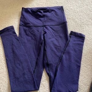 Purple speckled wunder under lululemon leggings.